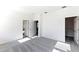 Spacious primary bedroom showcasing neutral walls, soft carpeting, and walk in closet at 9112 Wildlight Trl, Wildwood, FL 34785