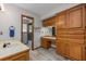 Bathroom featuring wood cabinets, tiled floors, and a shower room at 985 Willow Run Ln, Winter Springs, FL 32708