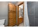 Bathroom featuring wood cabinets, tiled floors, a shower room, and a toilet at 985 Willow Run Ln, Winter Springs, FL 32708