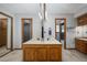 Bright bathroom featuring dual sinks, tile floors, and enclosed glass shower at 985 Willow Run Ln, Winter Springs, FL 32708
