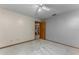 Spacious bedroom with neutral walls and carpet flooring, adjacent to another room, featuring door frame at 985 Willow Run Ln, Winter Springs, FL 32708