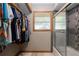 Walk-in closet with clothing racks and a window to the shower at 985 Willow Run Ln, Winter Springs, FL 32708