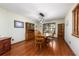 Traditional dining room with hardwood floors, decorative lighting, and built-in cabinets for ample storage at 985 Willow Run Ln, Winter Springs, FL 32708