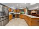 The bright kitchen offers stainless steel appliances and ample counter space for meal preparation and dining at 985 Willow Run Ln, Winter Springs, FL 32708