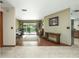 The living room features wood floors that offer access to the backyard pool through glass sliding doors at 985 Willow Run Ln, Winter Springs, FL 32708
