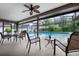 Covered lanai overlooking a beautiful outdoor pool, perfect for relaxation and entertainment at 985 Willow Run Ln, Winter Springs, FL 32708