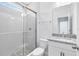 Modern bathroom with a glass-enclosed shower and granite vanity at 10322 Marconi Ave, Orlando, FL 32827