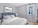 Comfortable bedroom featuring a plush bed, stylish decor, and a bright window for a relaxing atmosphere at 10322 Marconi Ave, Orlando, FL 32827