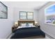 Bedroom featuring a comfortable bed, neutral decor, and a large window for natural light at 10322 Marconi Ave, Orlando, FL 32827