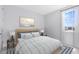 Serene bedroom with a comfortable bed, natural light, and stylish decor for a peaceful retreat at 10322 Marconi Ave, Orlando, FL 32827