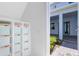 Inviting entryway showcasing a built-in shelving unit and view to a light blue exterior with brick pavers at 10322 Marconi Ave, Orlando, FL 32827
