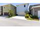 Three-story home with a two-car garage and well-maintained front yard at 10322 Marconi Ave, Orlando, FL 32827