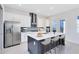 Contemporary kitchen featuring a large island, stainless steel appliances, and ample counter space for culinary enthusiasts at 10322 Marconi Ave, Orlando, FL 32827
