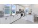Bright kitchen featuring white cabinets, granite countertops, and stainless steel appliances at 10322 Marconi Ave, Orlando, FL 32827