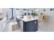 Spacious kitchen with a central island, modern appliances, and a seamless transition to the dining area at 10322 Marconi Ave, Orlando, FL 32827