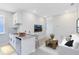 Open living space with a kitchenette, breakfast bar, and comfortable seating area at 10322 Marconi Ave, Orlando, FL 32827