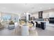 Open-concept living space showcasing a well-appointed kitchen, dining area, and cozy living room, perfect for entertaining at 10322 Marconi Ave, Orlando, FL 32827