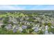 Aerial view of neighborhood homes next to green golf course at 104 Yorktown Pl, Sanford, FL 32771