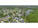 Residential area near a picturesque lake with lush green surroundings at 104 Yorktown Pl, Sanford, FL 32771