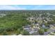 Spacious suburban neighborhood surrounded by lush trees in an overhead aerial view at 104 Yorktown Pl, Sanford, FL 32771