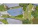 Aerial view of the yard with patio, outdoor furniture, fire pit, and waterfront access at 104 Yorktown Pl, Sanford, FL 32771