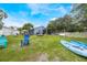 Backyard view showcasing water access, chairs, a fire pit, and partial fencing at 104 Yorktown Pl, Sanford, FL 32771