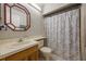 Bathroom with a vanity, mirror, tiled flooring, shower and a printed shower curtain at 104 Yorktown Pl, Sanford, FL 32771