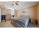 Neutral bedroom showcasing tiled floors, closet, and doorway leading to bathroom at 104 Yorktown Pl, Sanford, FL 32771