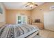 Bedroom with vaulted ceiling, tiled floors, and patio access at 104 Yorktown Pl, Sanford, FL 32771