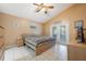 Bright bedroom featuring vaulted ceilings, tiled floors and sliding door access to the patio at 104 Yorktown Pl, Sanford, FL 32771