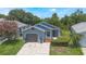 Charming single-story home with a well-maintained front yard and attached garage at 104 Yorktown Pl, Sanford, FL 32771