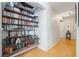 Hallway featuring a wooden bookcase with a variety of books on display at 104 Yorktown Pl, Sanford, FL 32771