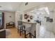 Open-concept kitchen with breakfast bar, views to living area and access to dining area at 104 Yorktown Pl, Sanford, FL 32771