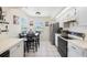 Bright eat-in kitchen with stainless steel appliances and a cozy dining area with views at 104 Yorktown Pl, Sanford, FL 32771