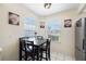 Charming kitchen nook with a breakfast table, natural light, and stylish decor at 104 Yorktown Pl, Sanford, FL 32771