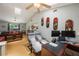 Open-concept living space with a skylight, ceiling fan, and comfortable seating area for relaxation at 104 Yorktown Pl, Sanford, FL 32771