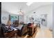 Bright living room featuring a ceiling fan, comfortable seating, and an open layout with a bar at 104 Yorktown Pl, Sanford, FL 32771
