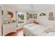 Cozy bedroom featuring a large window and hardwood floors at 109 Hunter Point Ct, Debary, FL 32713