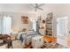 Spacious bedroom featuring a ceiling fan, hardwood floors, and ample storage space at 109 Hunter Point Ct, Debary, FL 32713