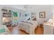 Charming bedroom with natural light, hardwood floors, and built-in shelving at 109 Hunter Point Ct, Debary, FL 32713