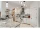 Modern kitchen featuring white cabinets, granite countertops, and stainless steel appliances at 109 Hunter Point Ct, Debary, FL 32713