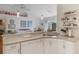 Bright kitchen with granite counters, stainless steel sink, and seamless flow into the living area at 109 Hunter Point Ct, Debary, FL 32713