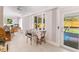 Bright sunroom with tile flooring and access to the backyard at 109 Hunter Point Ct, Debary, FL 32713