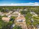 Aerial view of a single-Gathering home with a fenced-in backyard and mature trees in a residential neighborhood at 1276 Comerwood Dr, Deltona, FL 32738