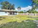 Exterior view of backyard, highlighting the expansive space and privacy provided by the wooden fence at 1276 Comerwood Dr, Deltona, FL 32738