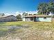 Spacious backyard with lush grass and a wood fence, ideal for pets and outdoor activities at 1276 Comerwood Dr, Deltona, FL 32738