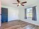 Bedroom featuring closet with hardwood floors, and large windows with natural light at 1276 Comerwood Dr, Deltona, FL 32738