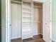 Walk-in closet features custom shelving, closet rods, and natural light at 1276 Comerwood Dr, Deltona, FL 32738