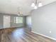 Inviting living area featuring wood-look flooring, a white front door and ample natural light at 1276 Comerwood Dr, Deltona, FL 32738