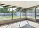 Screened patio offers outdoor space, with a view of the backyard and storage shed at 1276 Comerwood Dr, Deltona, FL 32738